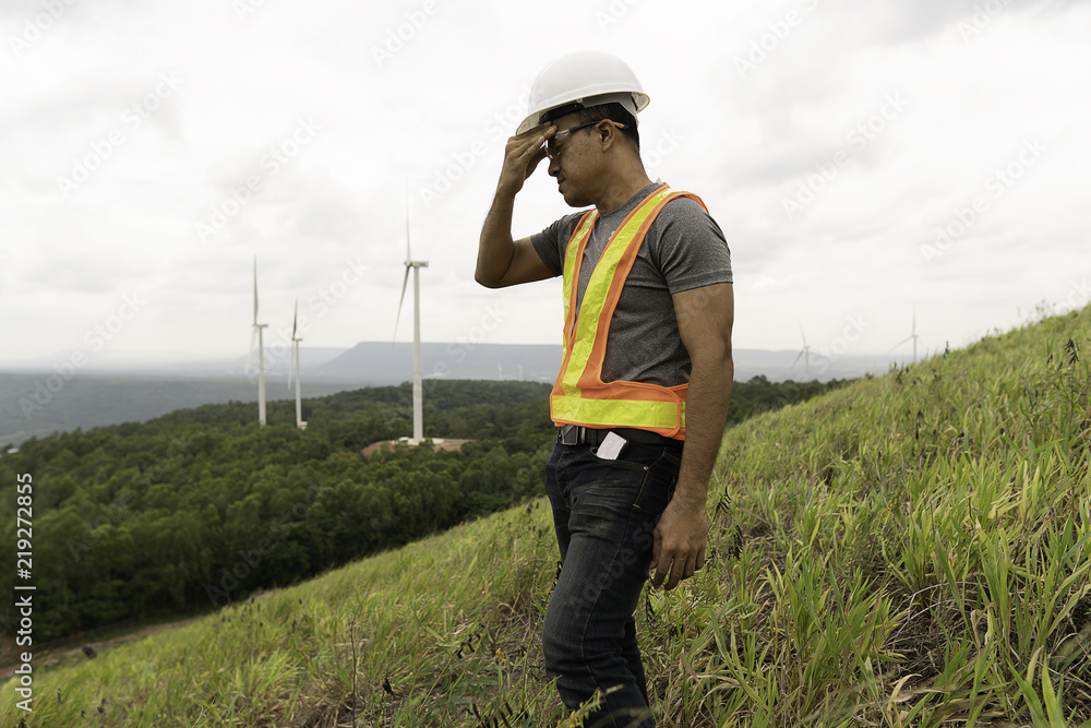 Electrical engineer man are standing stress with renewable power from ...