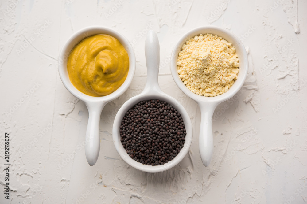 Rai or raw Mustard with sauce, powder and oil, over moody background. Selective focus
Rai or raw Mustard with sauce, powder and oil, over moody background. Selective focus