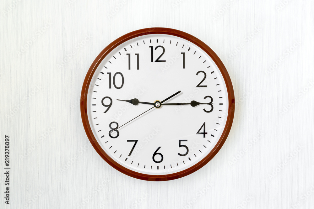 Simple round clock on a wall Simple round clock on a wall