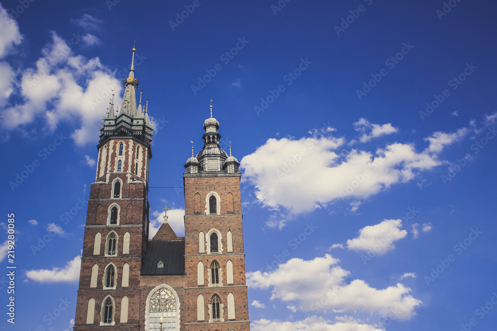 medieval old catholic church tower on blue sky cloud background with empty space for copy or text