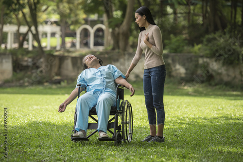 Bilde på lerret The daughter was shocked to see the shock on her mother sitting on wheelchair