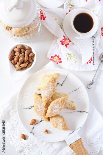 Italian cookie: almonds Canistrelli and cup of coffee photo