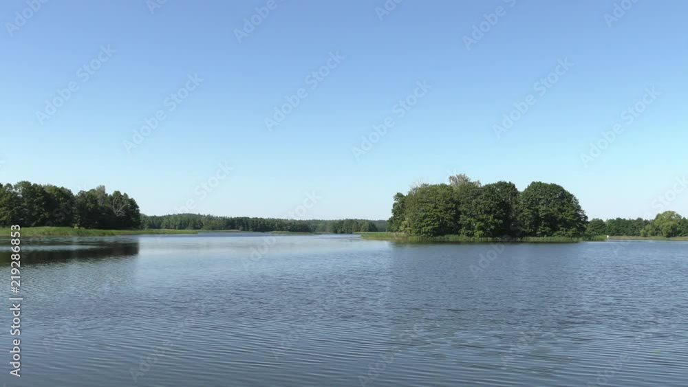 Polish lake. Beautiful lake, trees in the background. Panning,Closeup, Polish lake. Beautiful lake, trees in the background. Panning,Closeup,