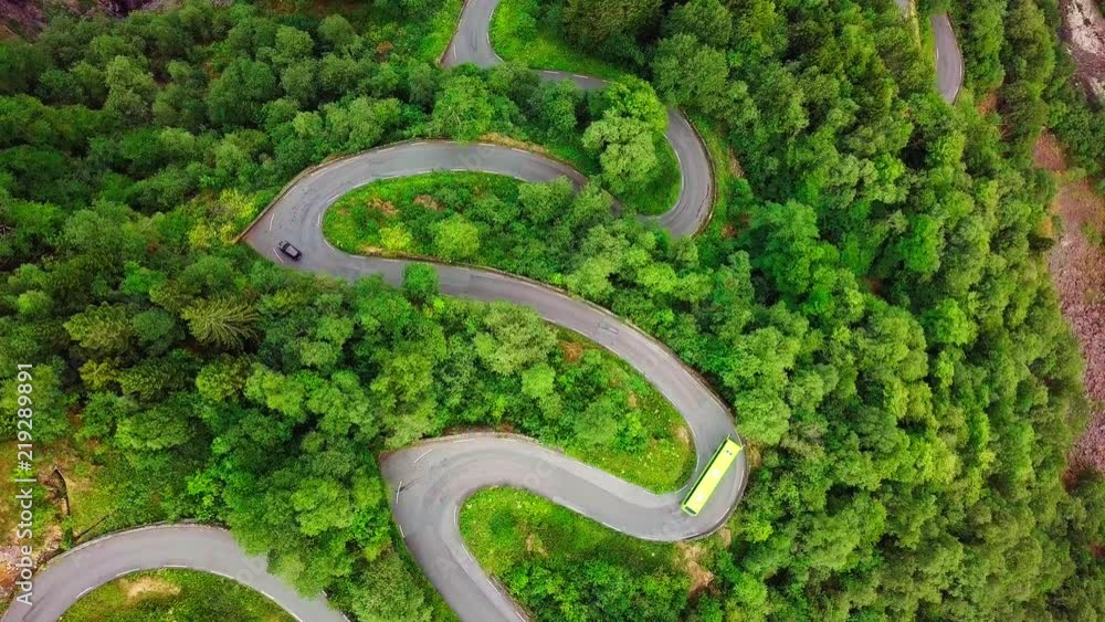 Aerial View landscape serpentine road winding on the mountains background in summer sunny day, Drone 4K Video Aerial View landscape serpentine road winding on the mountains background in summer sunny day, Drone 4K Video