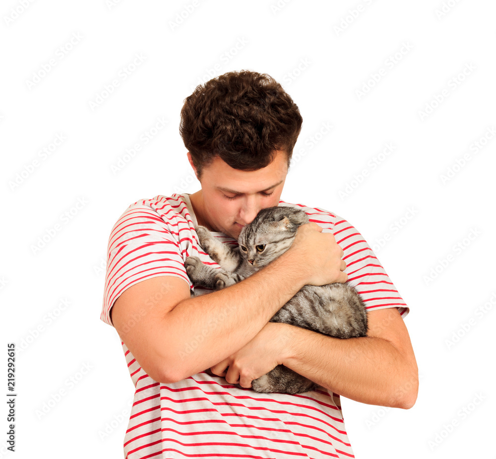 Obraz premium A cat and a man, a portrait of a happy cat with close eyes and a young man, people playing with a kitten. The guy hugs his pet. emotional man isolated on white background