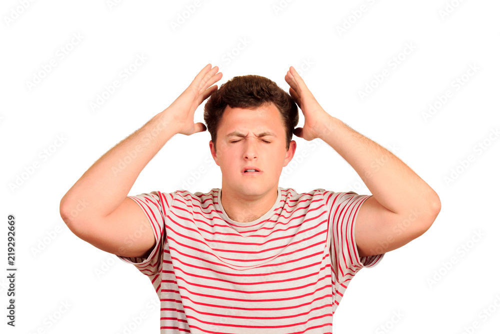 Young man wih headache cover head with hands. Exhausted depressed guy portrait. emotional man isolated on white background Young man wih headache cover head with hands. Exhausted depressed guy portrait. emotional man isolated on white background