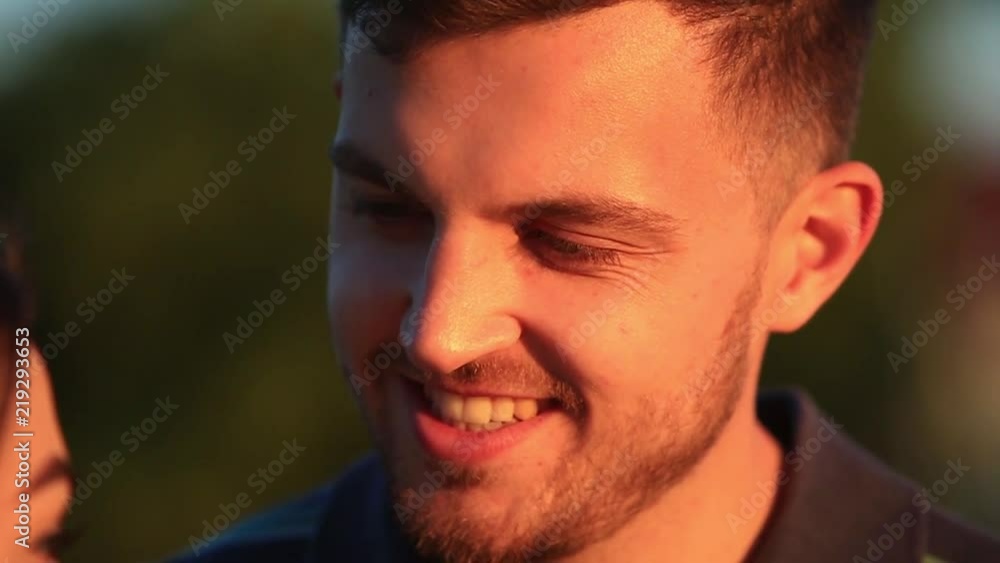 Beautiful couple hug each other while the sun sets. sunset. Close-up. 50fps Beautiful couple hug each other while the sun sets. sunset. Close-up. 50fps