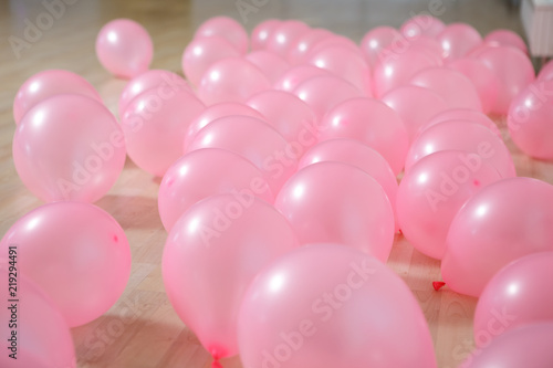 Pink balloons lying on the floor background