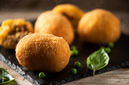 arancini di riso, fried risotto rice balls, italian sicilian food photo