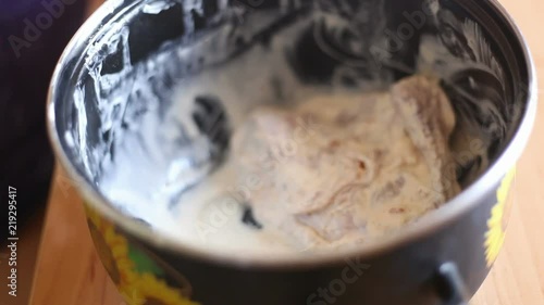 the cook takes pieces of chicken from the pan. Video close-up, high quality