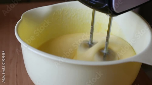 The mixer beats the eggs. Video close-up, high quality