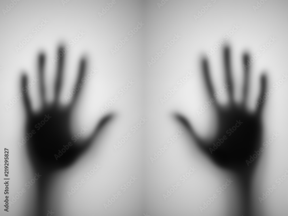 blurred of a hand behind matted glass.