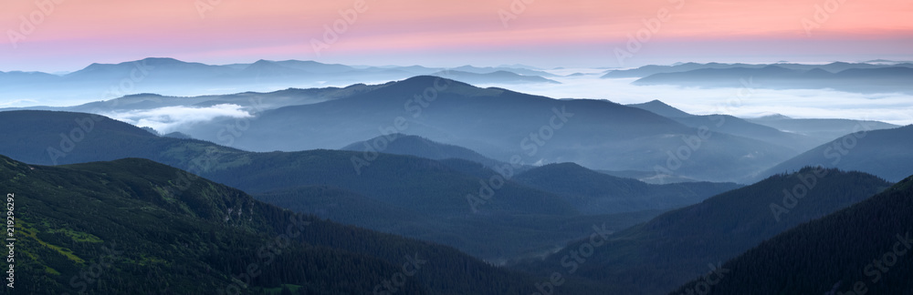 Scenery of the sunrise at the high mountains. Dense fog with beautiful light. A place to relax in the Carpathian Park. Hoverla, Carpathians, Ukraine, Europe.