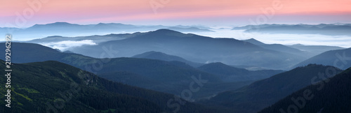 Scenery of the sunrise at the high mountains. Dense fog with beautiful light. A place to relax in the Carpathian Park. Hoverla, Carpathians, Ukraine, Europe.