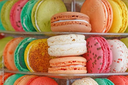 close up of color macaroons on shopwindow