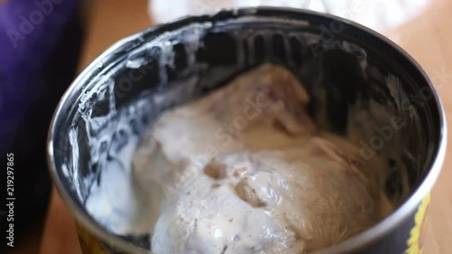 the cook takes pieces of chicken from the pan. Video close-up, high quality