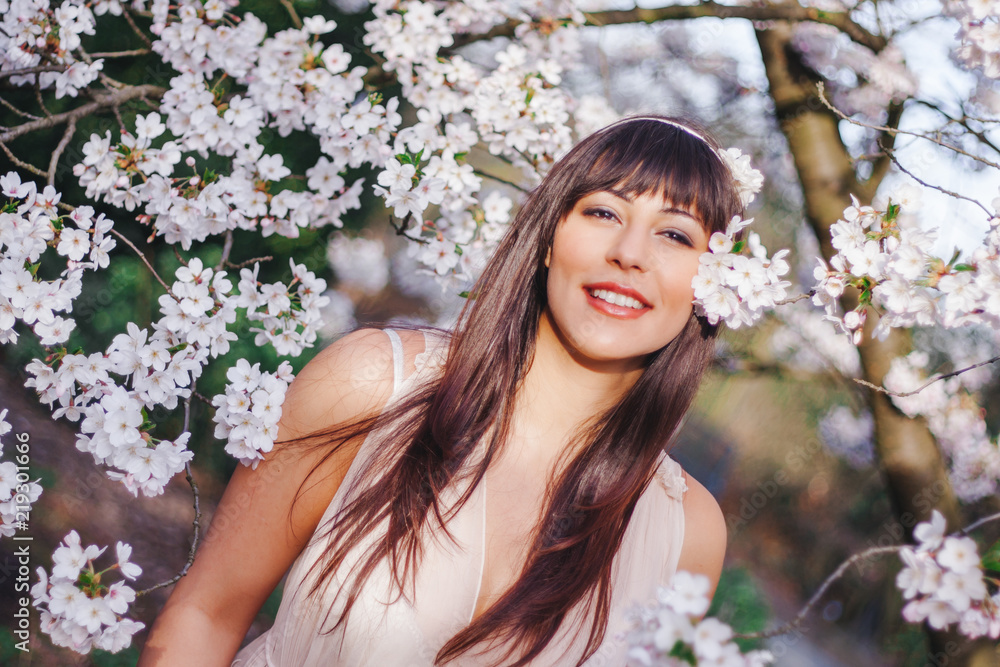 beautiful tender woman in light dress in cherry blossom trees beautiful tender woman in light dress in cherry blossom trees
