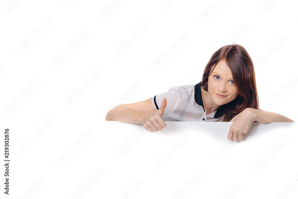 Beautiful brunette woman holding white signboard at white background Beautiful brunette woman holding white signboard at white background