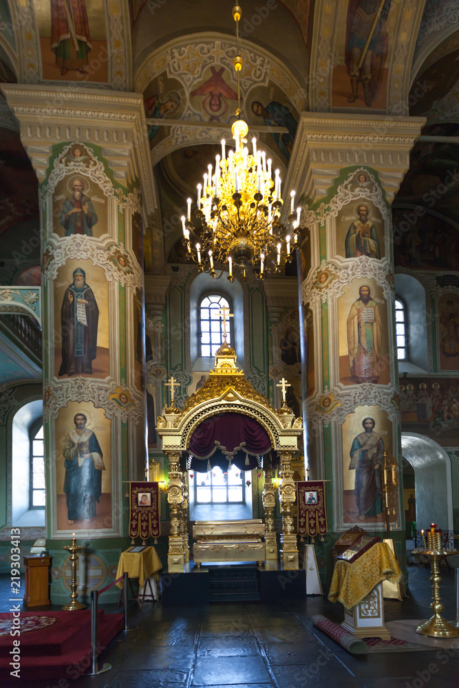 Interior with Burning candles in a Russian ortodox church. Close-up of ordinary church