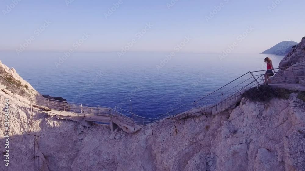 Girl Walking on the Ocean Cliff Aerial View Girl Walking on the Ocean Cliff Aerial View