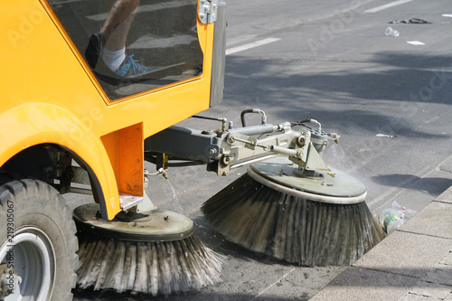 Street cleaning machine. Street sweeper machine working © polack