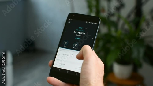 Checking Bitcoin wallet balance on mobile phone, your own bank in a smartphone concept
