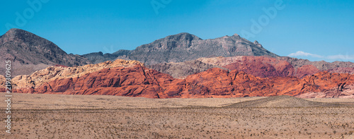 Panoramic view of hills of the Red Rock Canyon on a sunny day of summer, Nevada, USA.