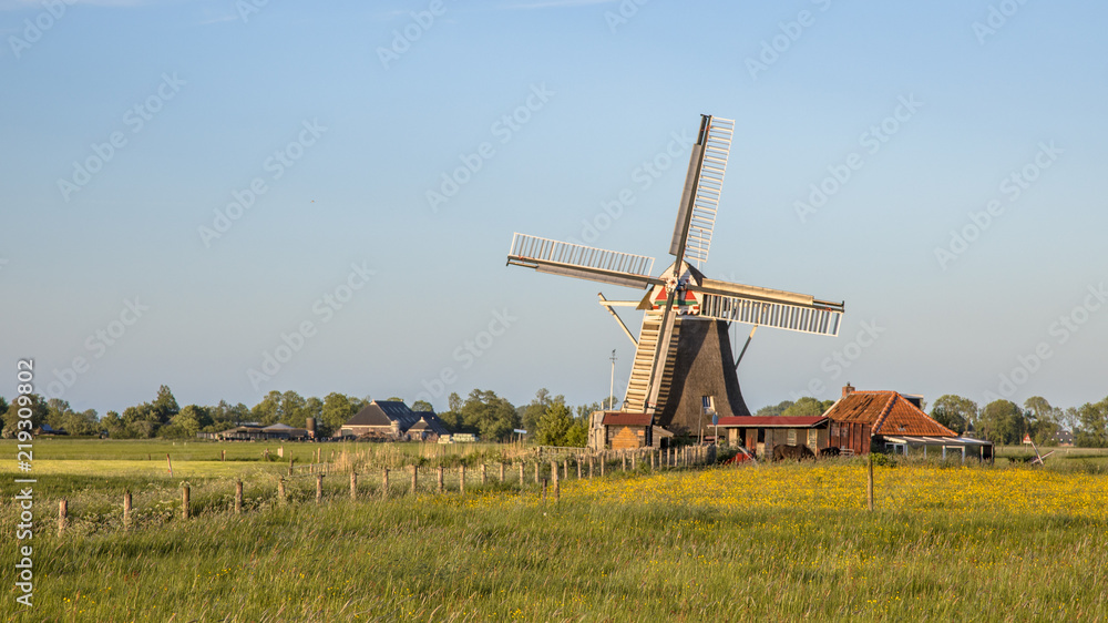 Fototapeta premium Wooden windmill on countryside