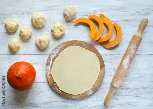 Cooking traditional pies with pumpkin. Placinta -Traditional homemade Romanian and Moldovan pies.
 photo