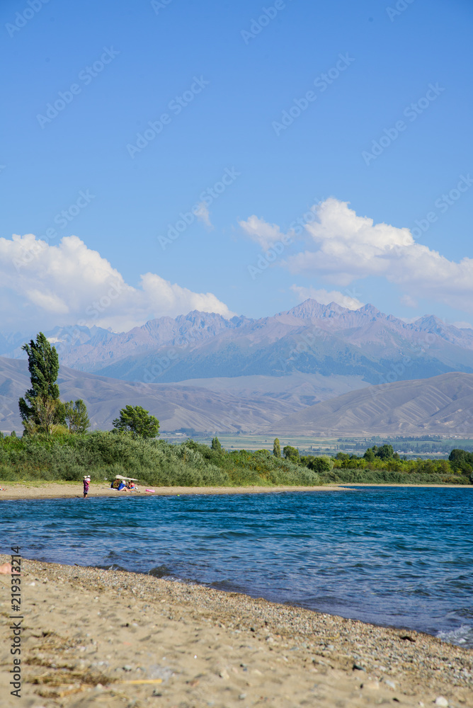 The Issyk-Kul lake with mountains in the background