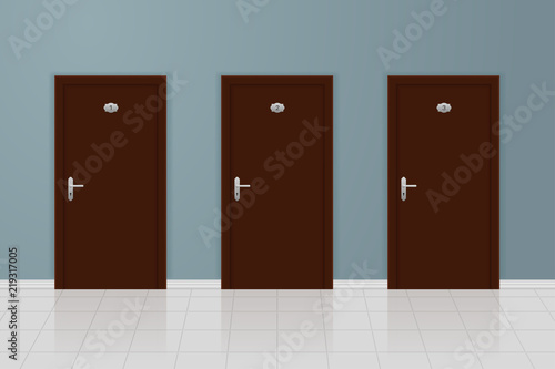Brown wooden doors on gray wall background