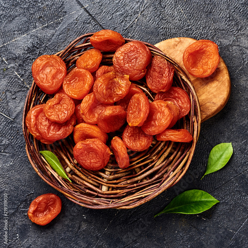 Dried apricots on gray background. Top view. photo