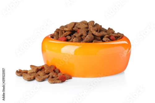 Fototapeta Naklejka Na Ścianę i Meble -  Bowl of dry pet food on white background
