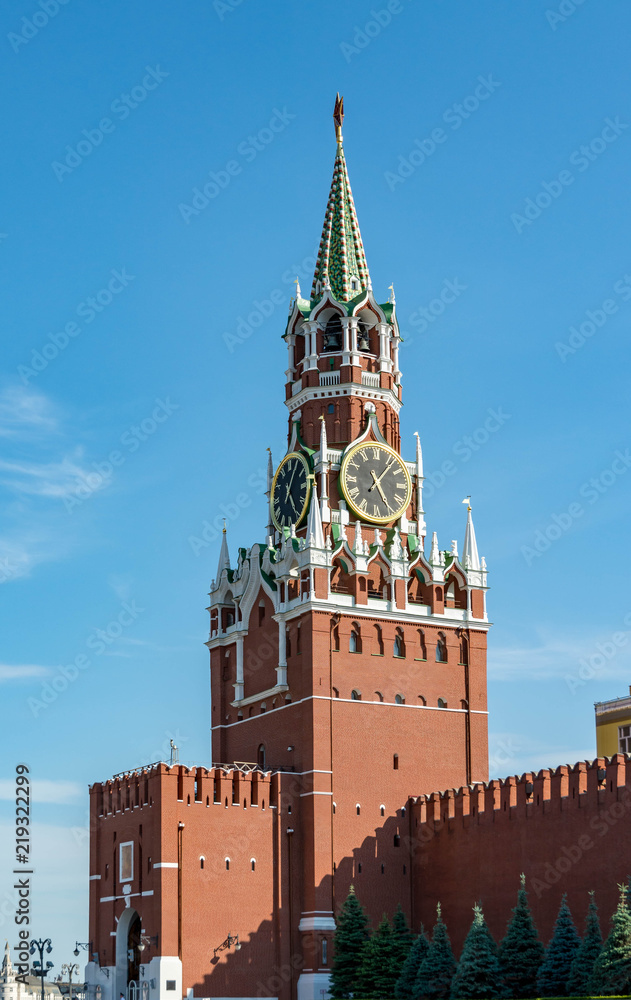 Spasskaya Tower against blue sky with white clouds. Kremlin. Spasskaya Tower against blue sky with white clouds. Kremlin.