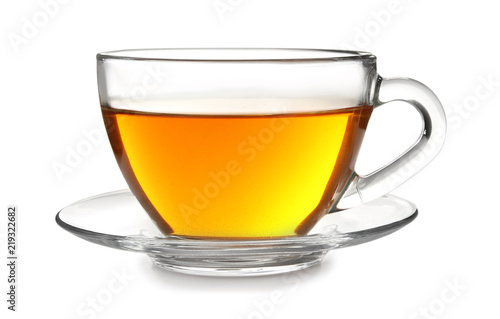 Glass cup with black tea on white background