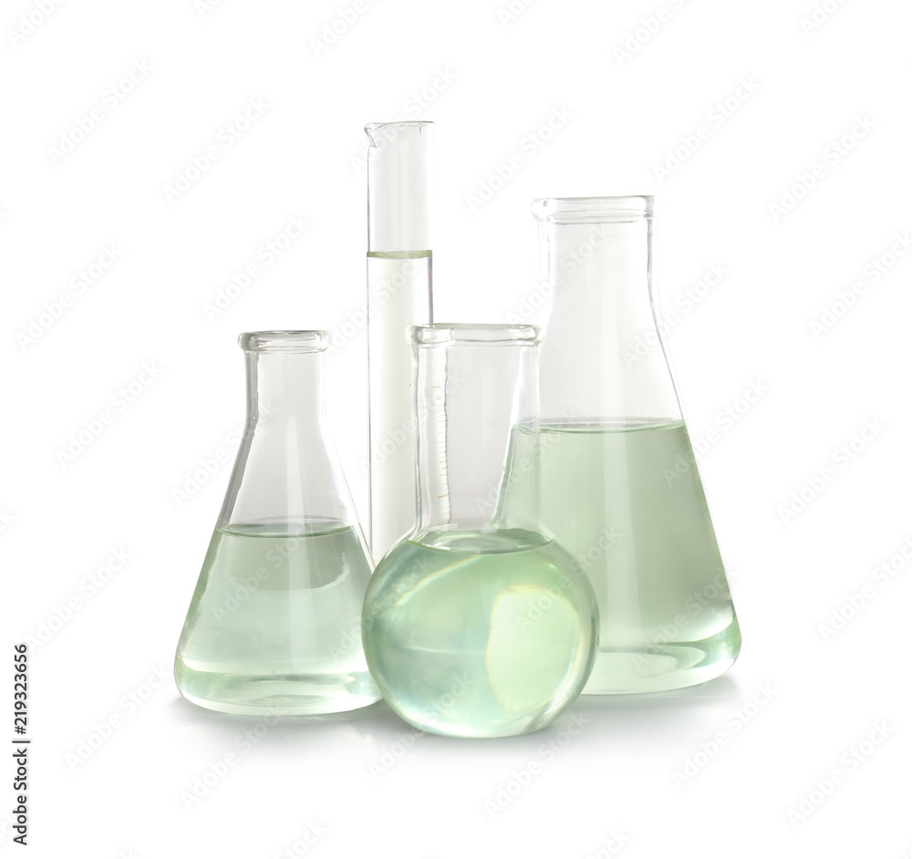 Laboratory glassware with liquid on white background. Chemical analysis Laboratory glassware with liquid on white background. Chemical analysis