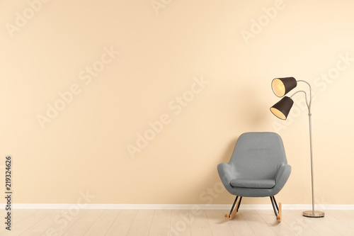 Fototapeta Naklejka Na Ścianę i Meble -  Stylish living room interior with comfortable armchair and space for text