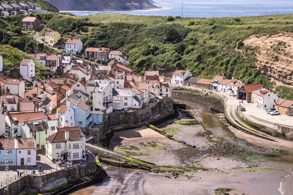 A view of the North Yorkshire UK villages of Staithes and Cowbar, seen here from from Penny Nab headland.