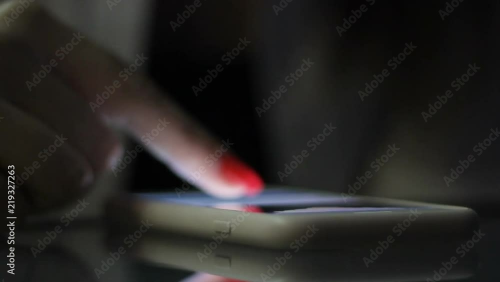 Adult female scrolling news ribbon in social networks, surfing net, dating sites Adult female scrolling news ribbon in social networks, surfing net, dating sites