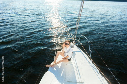Girl resting on a yacht, sailboat