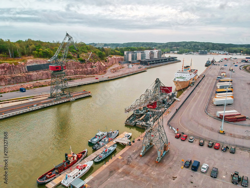 Photography Ships and old shipyard cranes at the river in the city of Turku