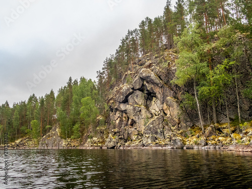 View of the  rocky steep cliffs of the Saimaa lake in the Kolovesi National Park in Finland - 1 photo