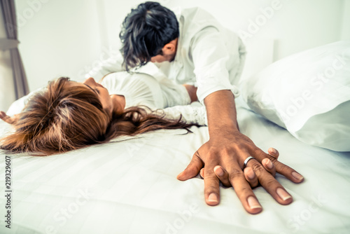 Romantic love of young couple in the bedroom.