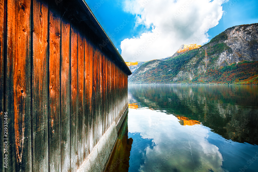 Boat house on Hallstatter lake. Sunnny autumn on Hallstatt lake. Boat house on Hallstatter lake. Sunnny autumn on Hallstatt lake.