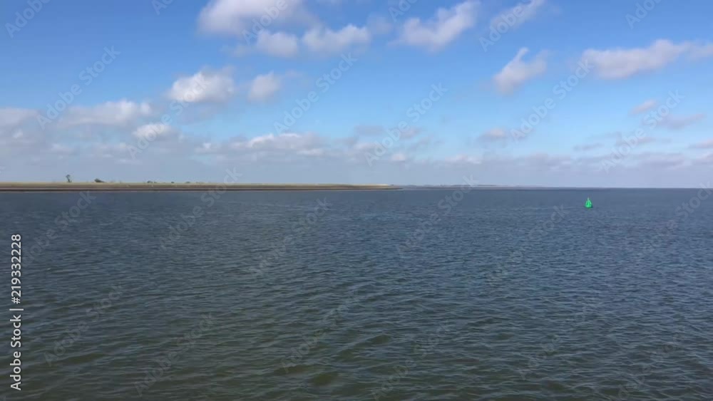 Sailing at the Wadden Sea in Friesland, The Netherlands Sailing at the Wadden Sea in Friesland, The Netherlands