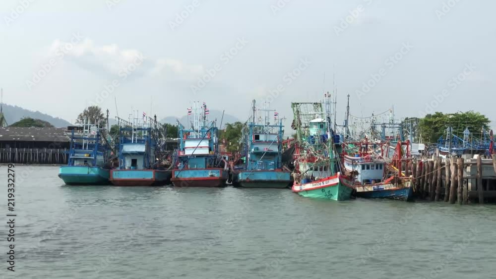 Passing by fishing boats and leaving the harbor of Rayong, Thailand Passing by fishing boats and leaving the harbor of Rayong, Thailand