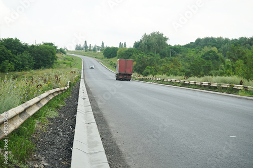 New roadbed and stormwater drainage. Stormwater drainage for drainage of rain water along the roadway.