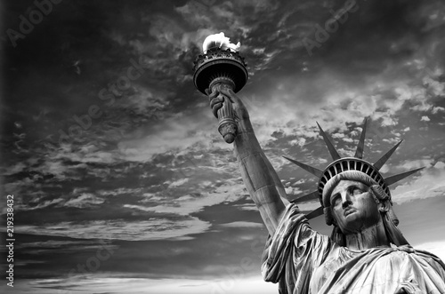 Photos Statue of Liberty, dramatic sky background. New York City, USA