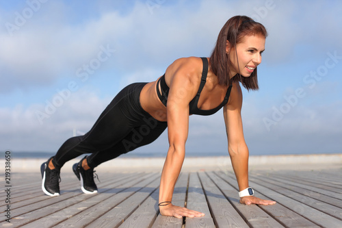 strong athletic girl holds a workout