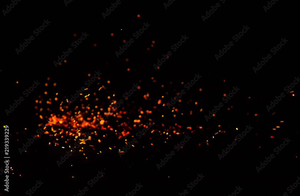 Flame of fire with sparks on a black background Flame of fire with sparks on a black background